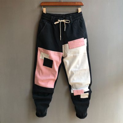 Mùa xuân mới của nam giới quần jean skinny xu hướng khâu vá quần ăn xin quần dài lưới màu đỏ giống quần harem cỡ lớn