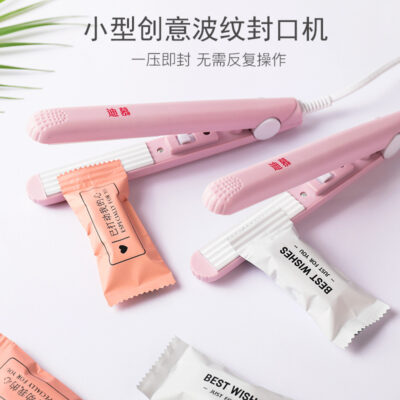 Máy đóng gói bánh quy đóng thùng túi áp suất tay loại hộ gia đình nhỏ di động máy đóng thùng nhựa lá nhôm kẹo hạnh phúc đóng thùng túi