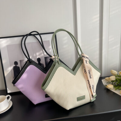 Túi đi biển nữ 2023 phong cách nước ngoài mới túi xô mua sắm thích hợp cao cấp cảm giác linh hoạt túi đeo vai túi tote