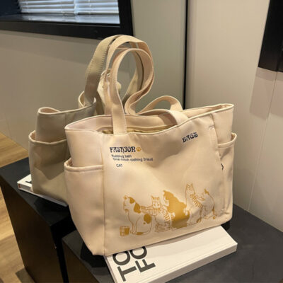 Túi vải có họa tiết thích hợp 2023 mới phù hợp với túi tote dung tích lớn phong cách nước ngoài hoạt hình ba lô thông thường túi nữ cỡ lớn