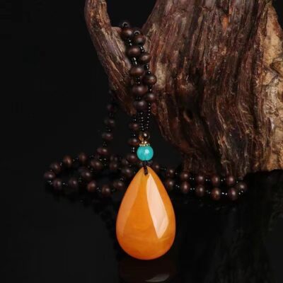 Giả hổ phách cao dầu gà màu vàng sáp ong giọt nước chuỗi áo len giọt nước dài mặt dây chuyền mặt dây chuyền phong cách dân tộc mặt dây chuyền cho nam và nữ