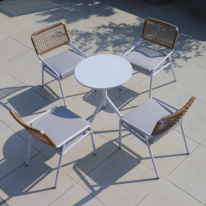 Outdoor-rattan-table-and-chair-combination-simple-garden-rooftop-high-end-balcony-Western-restaurant-leisure-table-2.webp