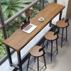 Ban công nhà Bàn bar gỗ đặc đơn giản quán trà sữa quán cafe bên cửa sổ Bàn ghế dài chân cao chân thấp