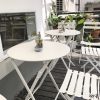 Bàn ghế Internet nổi tiếng trà sữa cửa hàng tráng miệng ngoài trời cafe sắt rèn gấp bộ ban công trắng ins đơn giản Bàn ghế